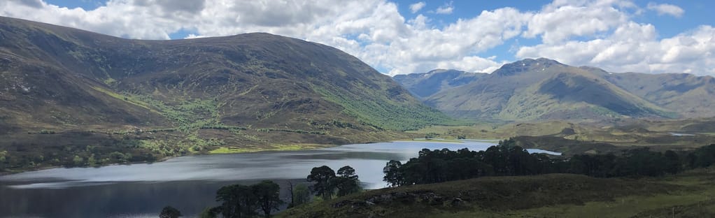 Aerial view along Glen Affric towards Affric Lodge and Loch Affric Scottish  Highlands, Scotland, UK